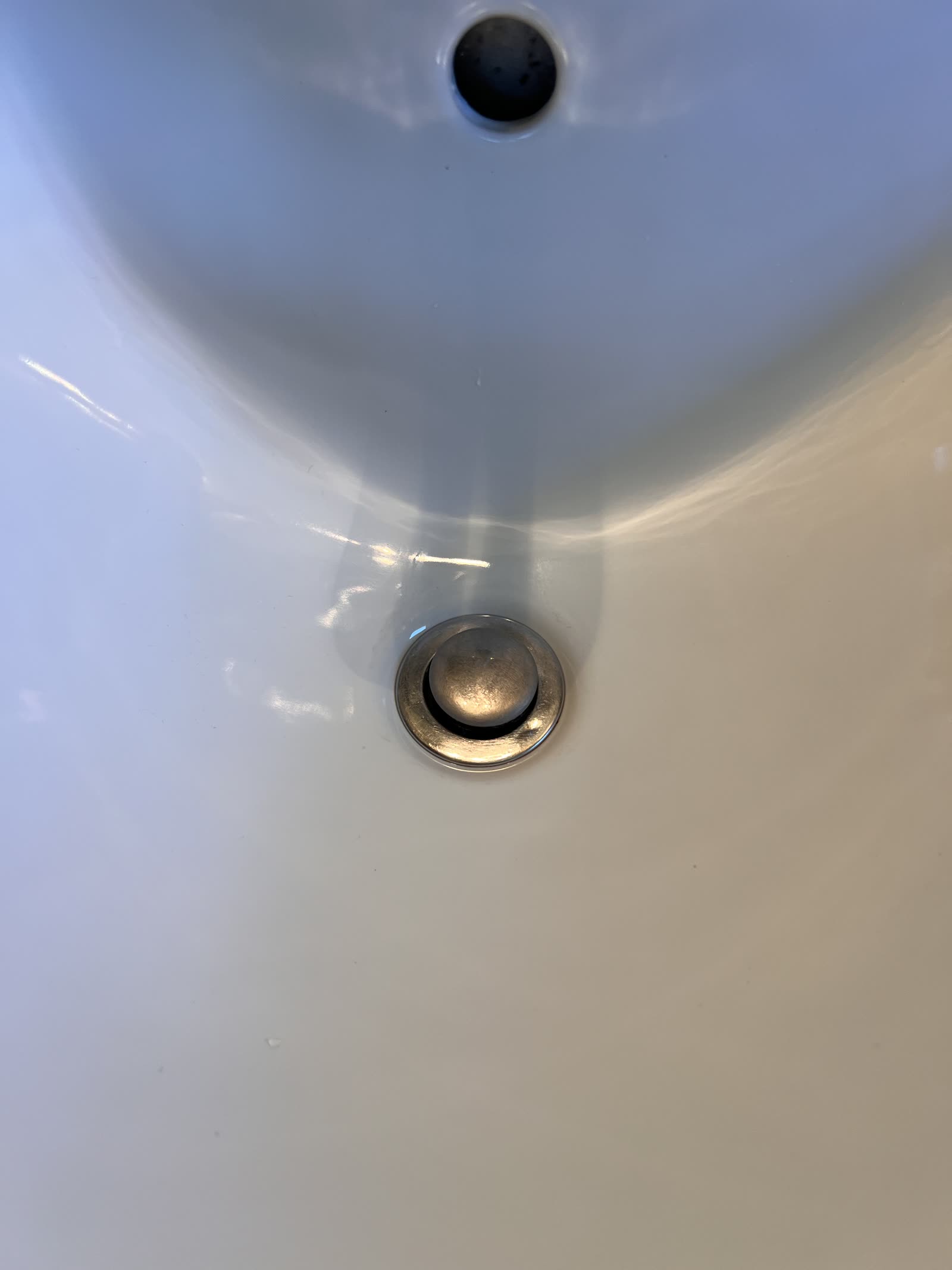 After: Sink drain — mineral and grime buildup